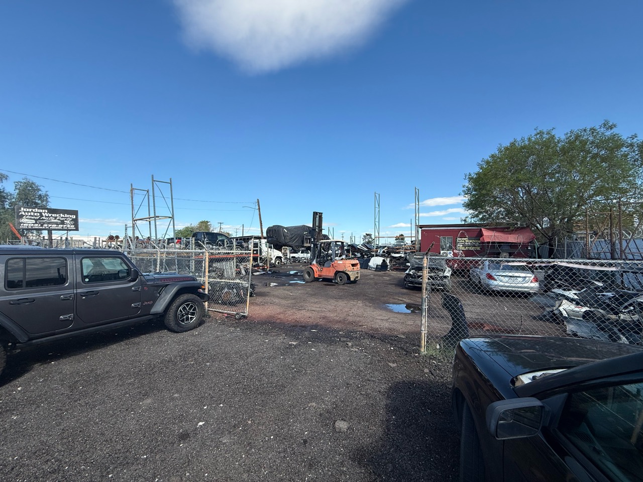Salvage vehicles and parts organized in the Jordan Auto Wrecking yard